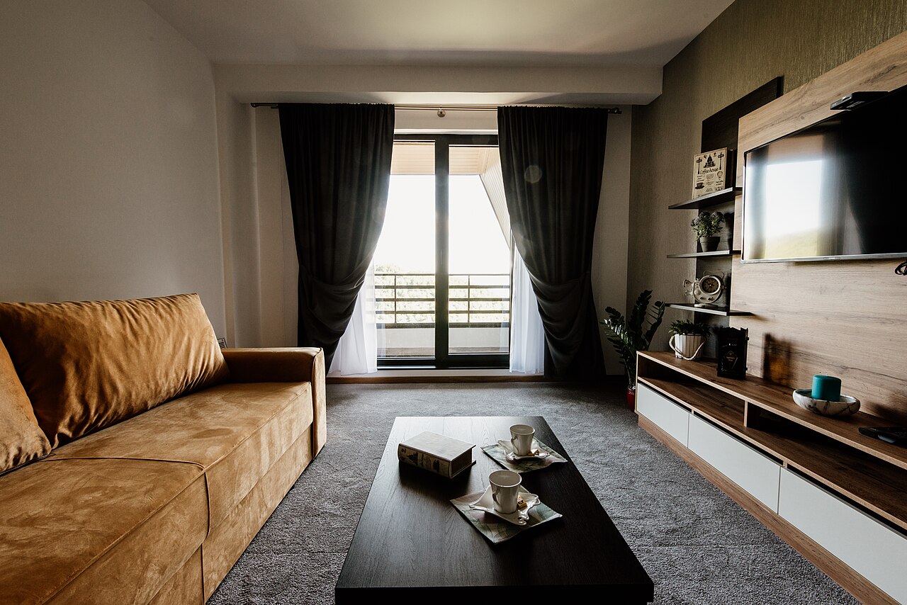 Cozy living room with a sofa, coffee table, and balcony light